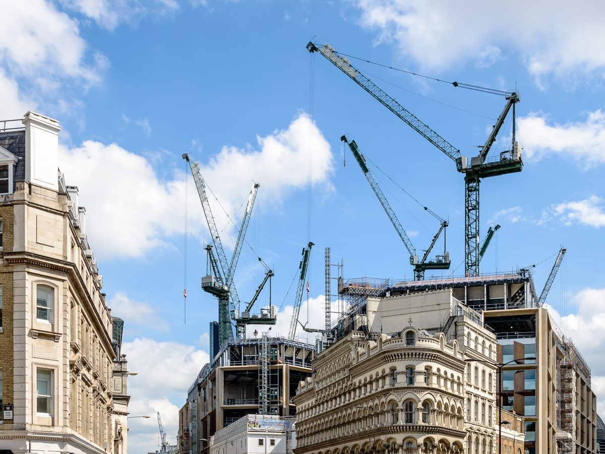 Cranes,On,A,Building,Under,Construction,In,London,A,Blue